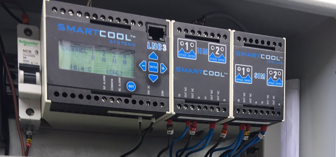 Smartcool controller units with membrane keypad overlays mounted on a control panel